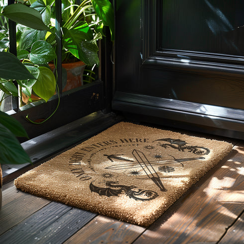 Coir doormat with "Only Light Enters Here" text, two dragons, crossed swords, and a celestial figure, all in dark brown on natural tan background.